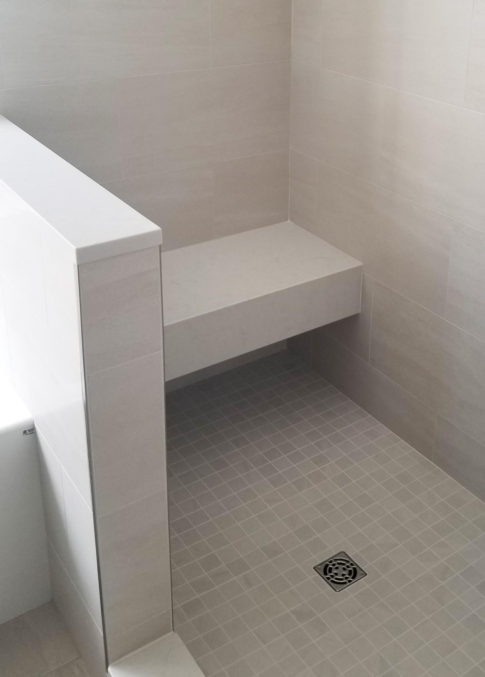 Mixed Tiled Bathroom With Bench